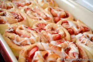 A twist on a classic favorite! This delicious Strawberry Cinnamon Rolls Recipe is a keeper! YUM!