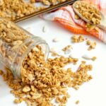 The warm spices of fall in a delicious granola blend. This Homemade Pumpkin Spice Granola Recipe is so easy to make and perfect sprinkled over a little bowl of yogurt or on its own. | @afewshortcuts #pumpkin #breakfast #granola #recipe #glutenfree #vegan #pumpkinspice